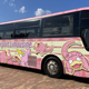 An aiport bus covered in Slowpoke.